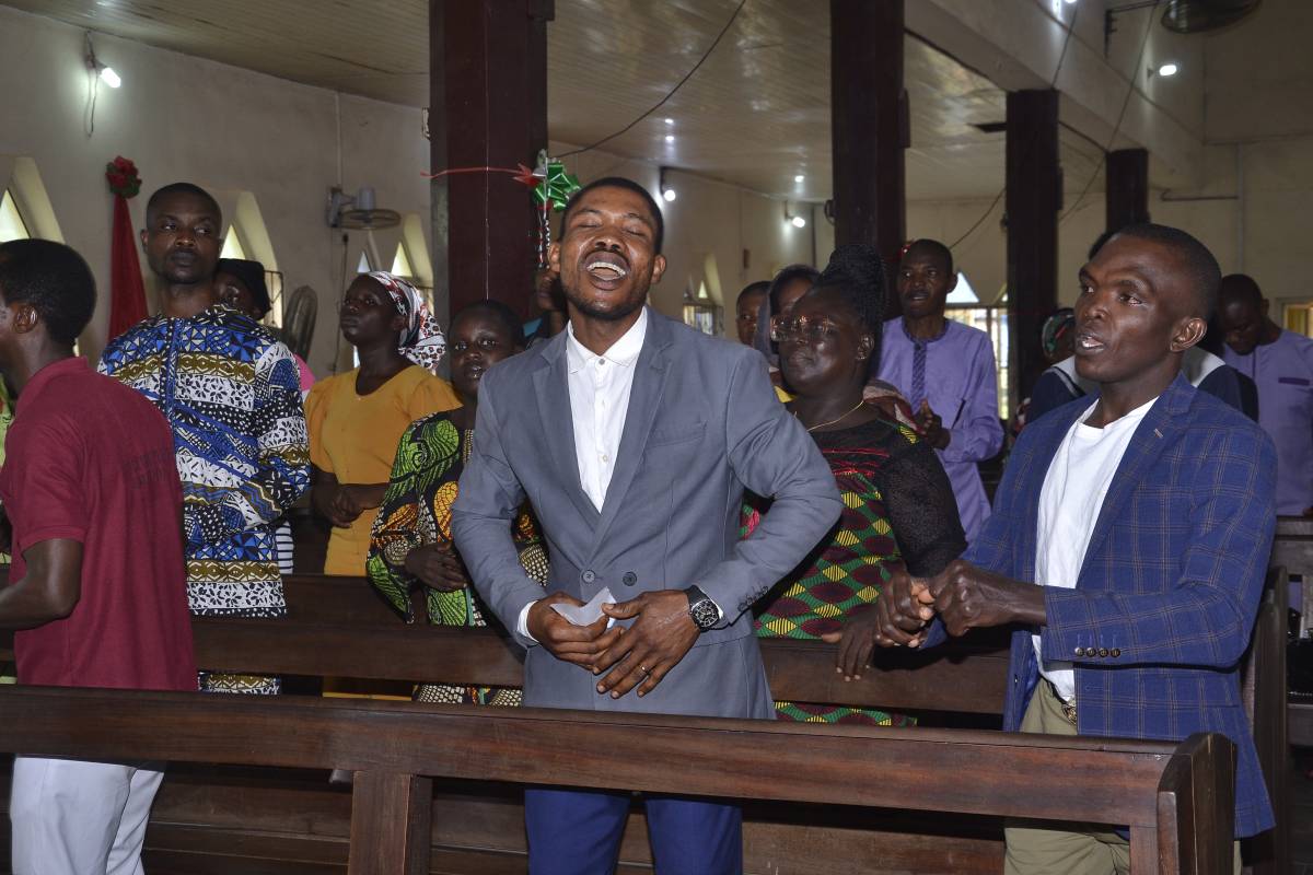 Ndokwa people singing and dancing at the New Testament dedication.